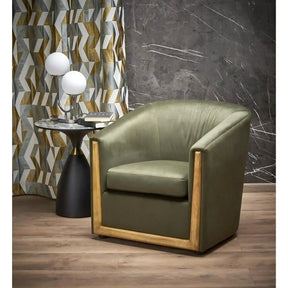 Fotoliu verde cu detalii negre, ideal pentru un living modern – primabucata